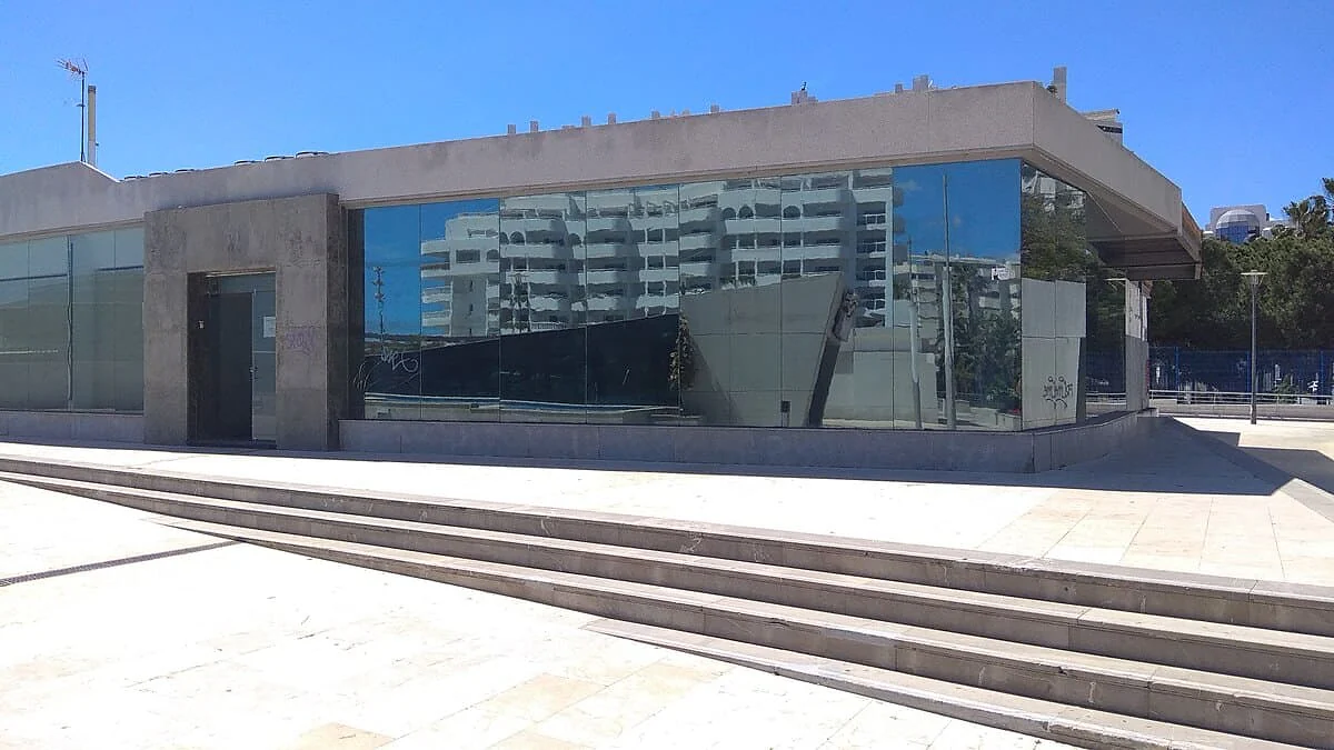 Exterior window film installation across a large office building elevation in Marbella
