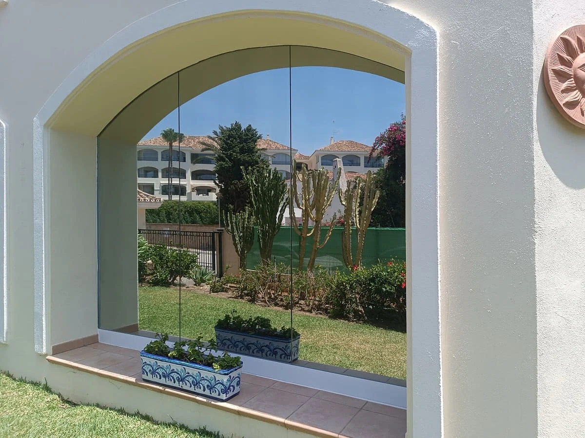 Privacy window film on an arched ground-floor window in Calahonda