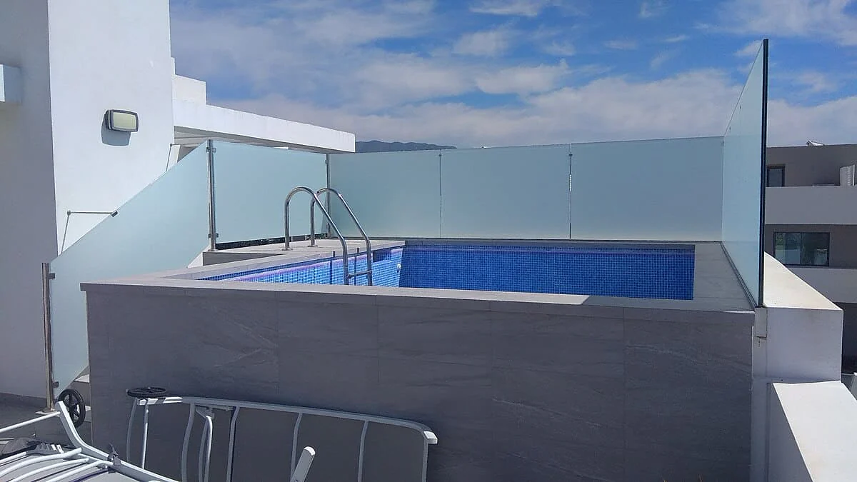 Frosted privacy film on rooftop pool balustrade glass in La Cala de Mijas