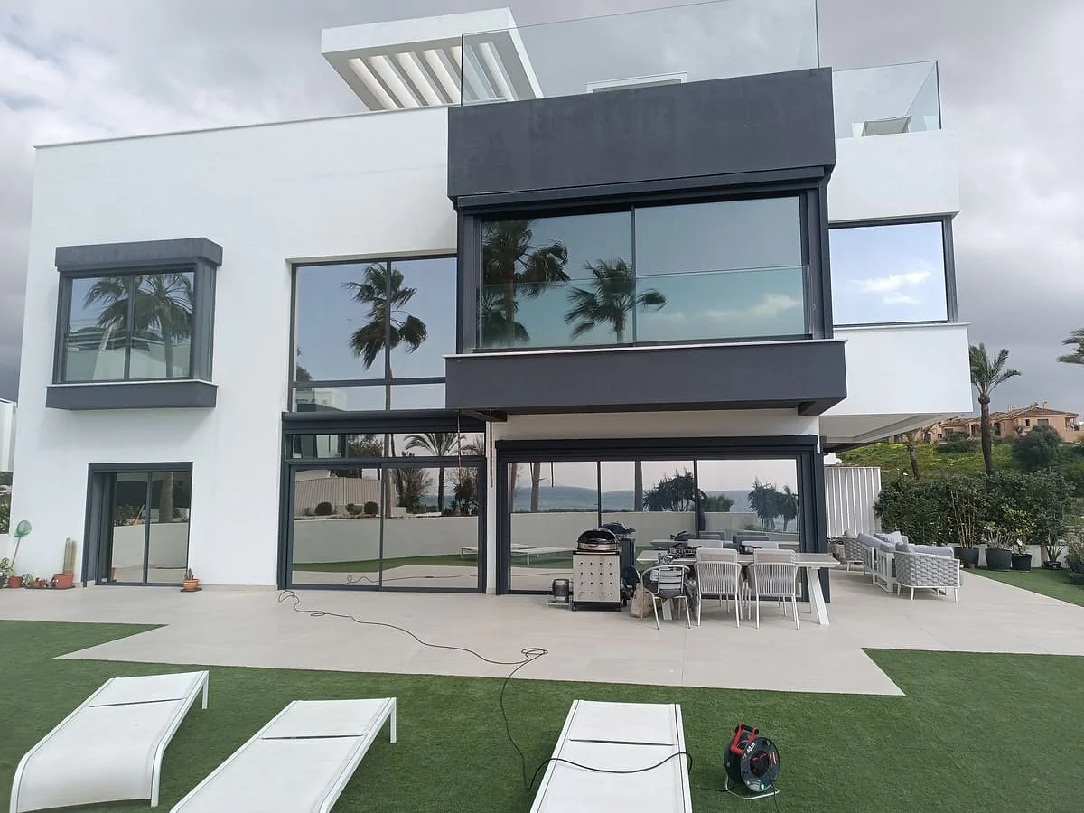 Solar heat control and privacy film on the upper-floor glazing of a contemporary Estepona villa