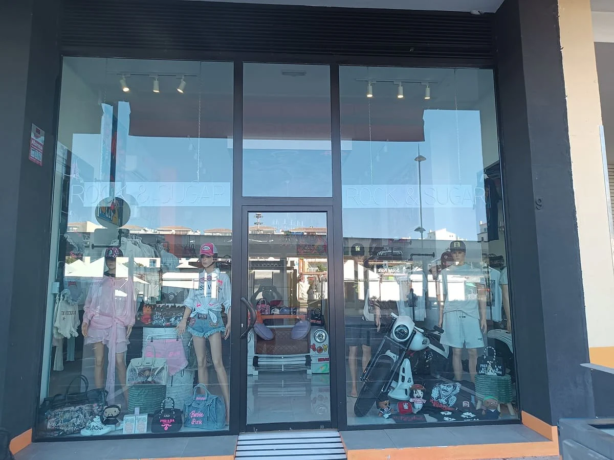 Clear UV protection film on a fashion boutique shopfront in Puerto Banús